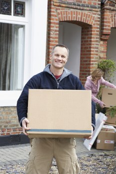 Removal team loading household items for transport