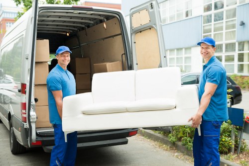 Furniture collection team removing bulky items from a Kingston upon Thames home