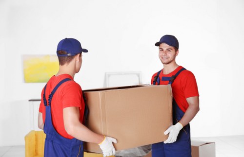 Professional movers handling household items in Kingston upon Thames