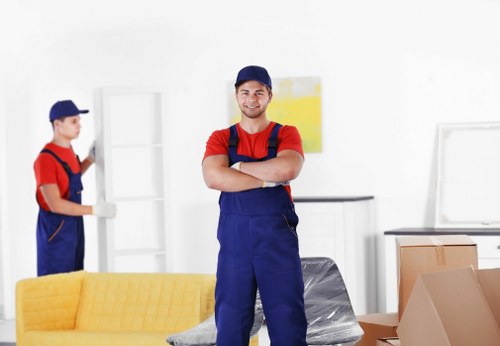 Local removals team handling furniture near Kingston town centre