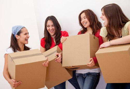Business relocation crew organizing office equipment in Kingston upon Thames