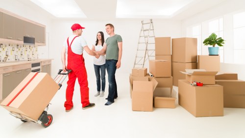 Removal team checking inventory and damage records after a move