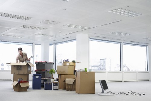 Professional movers handling household furniture during a local house move
