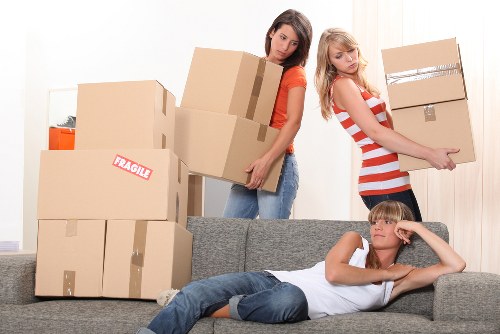 Packed moving boxes and protective materials ready for a house move